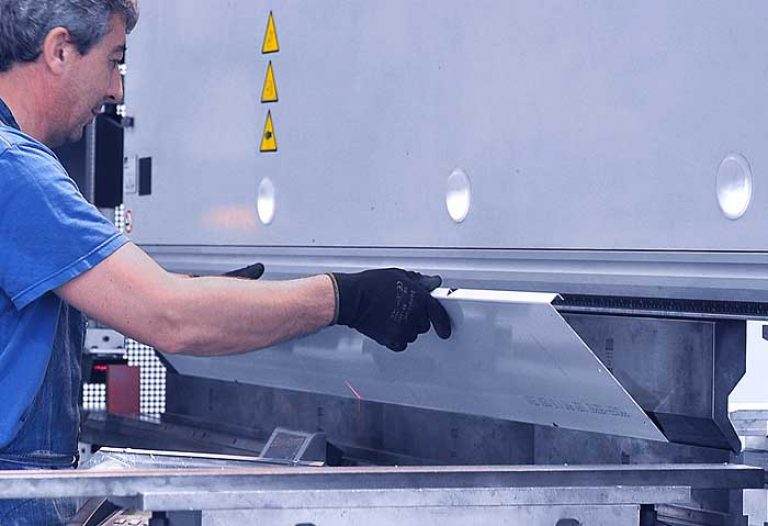 worker at  a manual folding machine